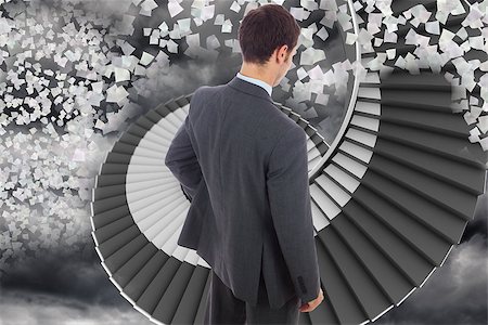 person on winding stairs - Businessman standing with hand on hip against winding staircase in the sky with flying papers Stock Photo - Budget Royalty-Free & Subscription, Code: 400-07278407