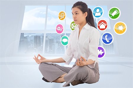 simsearch:400-07277726,k - Businesswoman sitting in lotus pose against steps made from books Stock Photo - Budget Royalty-Free & Subscription, Code: 400-07278422