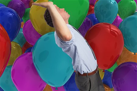 simsearch:400-07665425,k - Businessman standing with hands up against colourful balloons Stockbilder - Microstock & Abonnement, Bildnummer: 400-07278444