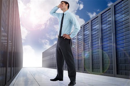 simsearch:400-07448129,k - Thoughtful businessman with hand on head against server hallway in the sky Stock Photo - Budget Royalty-Free & Subscription, Code: 400-07278441