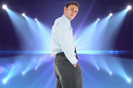 simsearch:400-07446676,k - Serious businessman standing with hands in pockets against cool nightlife lights Foto de stock - Super Valor sin royalties y Suscripción, Código: 400-07278500