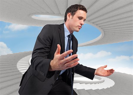 person on winding stairs - Businessman posing with arms out against spiral staircase in the sky Stock Photo - Budget Royalty-Free & Subscription, Code: 400-07278551