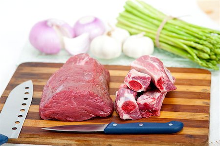 prime rib - raw beef and pork ribs with asparagus and herbs ready to cook Stock Photo - Budget Royalty-Free & Subscription, Code: 400-07278645