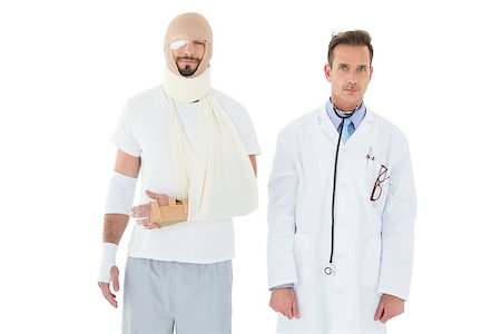 simsearch:400-04255649,k - Portrait of a doctor with patient tied up in bandage over  white background Foto de stock - Royalty-Free Super Valor e Assinatura, Número: 400-07270010