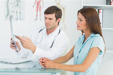 simsearch:400-07269250,k - Male doctor explaining lungs x-ray to female patient in the medical office Stock Photo - Budget Royalty-Free & Subscription, Code: 400-07270829