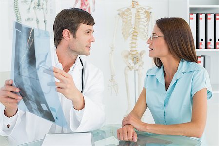 simsearch:400-07269250,k - Male doctor explaining spine x-ray to female patient in the medical office Stock Photo - Budget Royalty-Free & Subscription, Code: 400-07270839