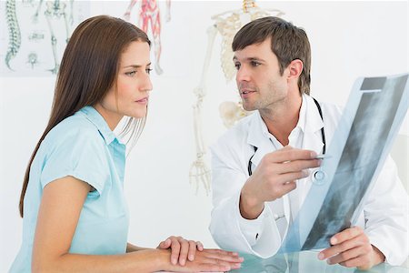 simsearch:400-07269250,k - Male doctor explaining spine x-ray to female patient in the medical office Stock Photo - Budget Royalty-Free & Subscription, Code: 400-07270846