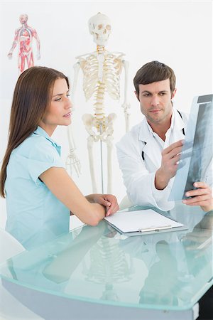 simsearch:400-07269250,k - Male doctor explaining spine x-ray to female patient in the medical office Stock Photo - Budget Royalty-Free & Subscription, Code: 400-07270857