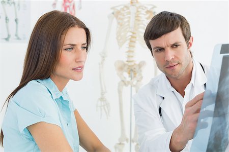 simsearch:400-07269250,k - Male doctor explaining spine x-ray to female patient in the medical office Stock Photo - Budget Royalty-Free & Subscription, Code: 400-07270867