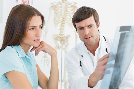 simsearch:400-07269250,k - Male doctor explaining spine x-ray to female patient in the medical office Stock Photo - Budget Royalty-Free & Subscription, Code: 400-07270863