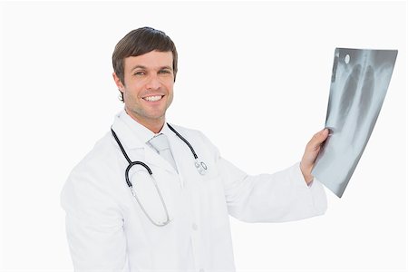 simsearch:400-07269250,k - Portrait of a smiling male doctor holding an x-ray picture of lungs over white background Stock Photo - Budget Royalty-Free & Subscription, Code: 400-07270924