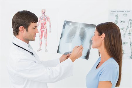 simsearch:400-07269250,k - Male doctor explaining lungs x-ray to female patient in the medical office Stock Photo - Budget Royalty-Free & Subscription, Code: 400-07270934