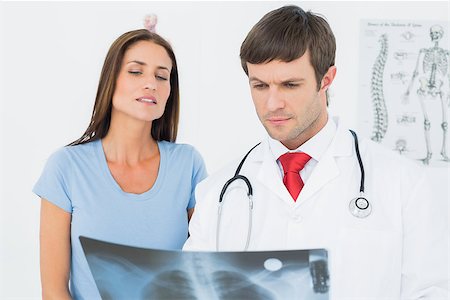 simsearch:400-07269250,k - Male doctor explaining lungs x-ray to female patient in the medical office Stock Photo - Budget Royalty-Free & Subscription, Code: 400-07270947
