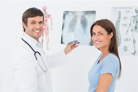 simsearch:400-07269250,k - Portrait of a smiling male doctor explaining lungs x-ray to female patient in the medical office Stock Photo - Budget Royalty-Free & Subscription, Code: 400-07270940