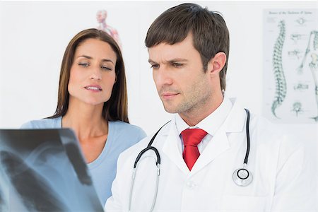 simsearch:400-07269250,k - Male doctor explaining lungs x-ray to female patient in the medical office Stock Photo - Budget Royalty-Free & Subscription, Code: 400-07270950