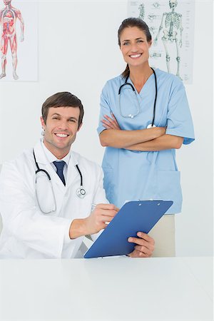 simsearch:400-07269250,k - Portrait of a male doctor and female surgeon with reports in a medical office Stock Photo - Budget Royalty-Free & Subscription, Code: 400-07271037