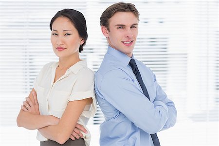 simsearch:400-07275828,k - Portrait of two business colleagues standing with arms crossed in the office Photographie de stock - Aubaine LD & Abonnement, Code: 400-07272898