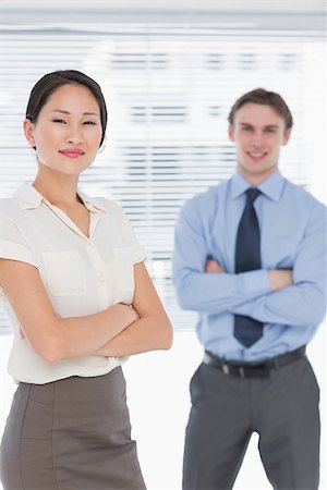 simsearch:400-07275828,k - Portrait of two business colleagues standing with arms crossed in the office Photographie de stock - Aubaine LD & Abonnement, Code: 400-07272904