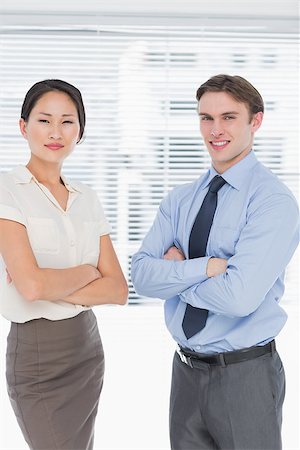 simsearch:400-07275828,k - Portrait of two business colleagues standing with arms crossed in the office Photographie de stock - Aubaine LD & Abonnement, Code: 400-07272901