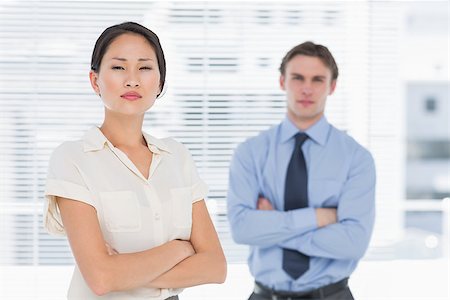 simsearch:400-07275828,k - Portrait of two business colleagues standing with arms crossed in the office Photographie de stock - Aubaine LD & Abonnement, Code: 400-07272902