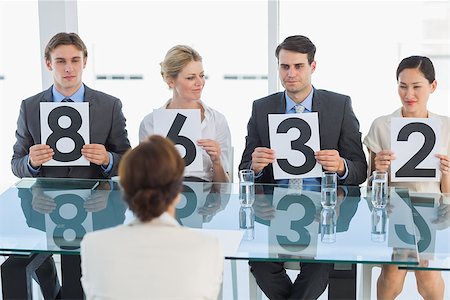 simsearch:649-07238264,k - Group of panel judges in a row holding score signs Foto de stock - Super Valor sin royalties y Suscripción, Código: 400-07272989