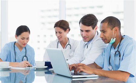 doctor office group - Group of young doctors in a meeting at hospital Stock Photo - Budget Royalty-Free & Subscription, Code: 400-07273076