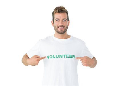 Portrait of a happy male volunteer pointing to himself over white background Stockbilder - Microstock & Abonnement, Bildnummer: 400-07273246