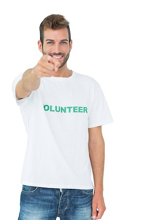 simsearch:400-08575784,k - Portrait of a happy male volunteer pointing at you over white background Stockbilder - Microstock & Abonnement, Bildnummer: 400-07273254