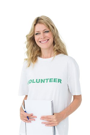 Portrait of a smiling young female volunteer over white background Stockbilder - Microstock & Abonnement, Bildnummer: 400-07273266