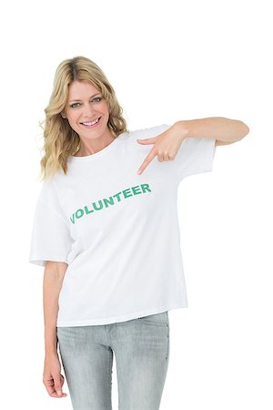 simsearch:400-08575784,k - Portrait of a happy female volunteer pointing to herself over white background Stockbilder - Microstock & Abonnement, Bildnummer: 400-07273262