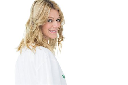 Portrait of a smiling young female volunteer standing over white background Stockbilder - Microstock & Abonnement, Bildnummer: 400-07273272