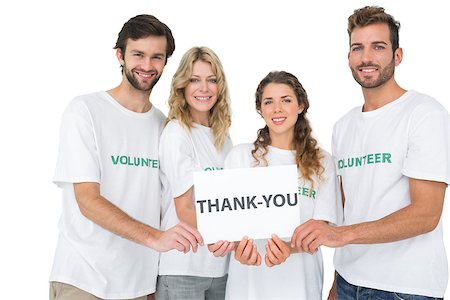 simsearch:400-07273325,k - Group portrait of happy volunteers holding thank you board over white background Foto de stock - Royalty-Free Super Valor e Assinatura, Número: 400-07273297