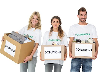 simsearch:400-07273325,k - Portrait of three smiling young people with donation boxes over white background Foto de stock - Royalty-Free Super Valor e Assinatura, Número: 400-07273291