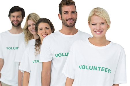 simsearch:400-07273325,k - Group portrait of happy volunteers standing in a row over white background Foto de stock - Royalty-Free Super Valor e Assinatura, Número: 400-07273308