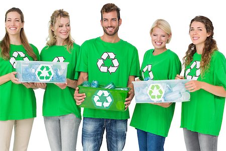simsearch:400-07273307,k - Group portrait of young people in recycling symbol tshirts carrying boxes over white background Stockbilder - Microstock & Abonnement, Bildnummer: 400-07273337