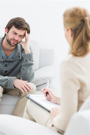 simsearch:400-07274690,k - Young man in meeting with a financial adviser at home Foto de stock - Super Valor sin royalties y Suscripción, Código: 400-07273366