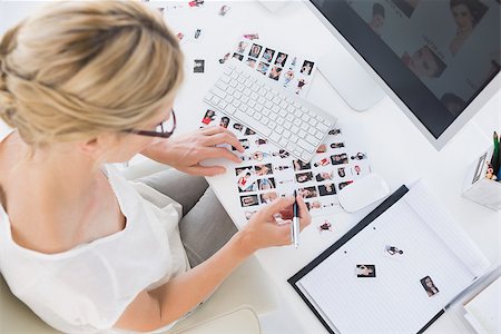 High angle view of a female photo editor at work in the office Stock Photo - Budget Royalty-Free & Subscription, Code: 400-07273571