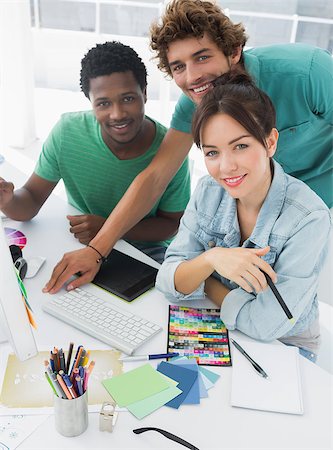 Portrait of three smiling artists working on computer at the office Stock Photo - Budget Royalty-Free & Subscription, Code: 400-07273933