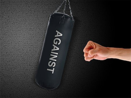 boxing punch bag and hand punching it on black background Stock Photo - Budget Royalty-Free & Subscription, Code: 400-07288312
