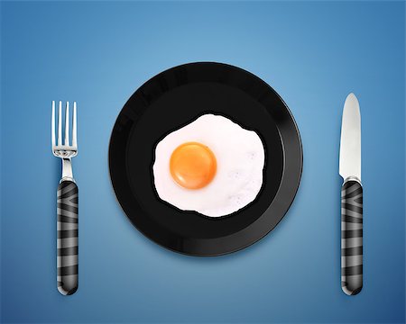 simsearch:400-07916427,k - top view of  fried egg on black Plate between silver knife and fork on orange background. Foto de stock - Super Valor sin royalties y Suscripción, Código: 400-07288351