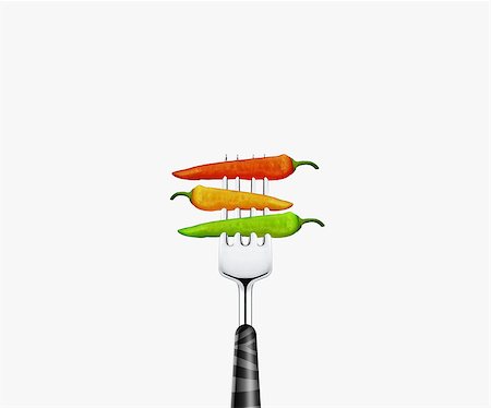 close up of Three chilies pierced by fork,  isolated on white background Stock Photo - Budget Royalty-Free & Subscription, Code: 400-07288942