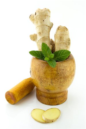 simsearch:400-06358844,k - Mortar with fresh Ginger root and mints on a white background. Photographie de stock - Aubaine LD & Abonnement, Code: 400-07289196