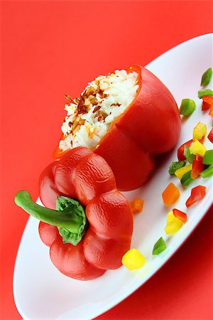 Stuffed red pepper in a dish on red background . Stock Photo - Budget Royalty-Free & Subscription, Code: 400-07289590