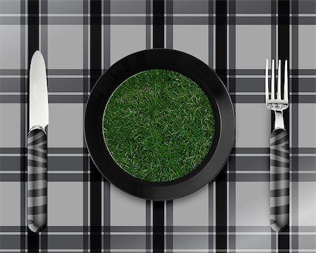 simsearch:400-07289835,k - green grass on black plate with knife and fork. Photographie de stock - Aubaine LD & Abonnement, Code: 400-07289835