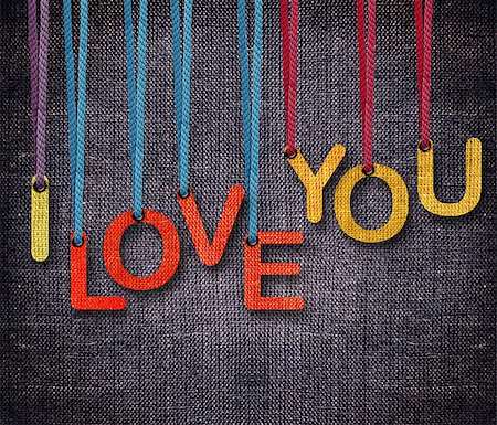 I love you hanging by rope as puppeteer on sackcloth background. Stock Photo - Budget Royalty-Free & Subscription, Code: 400-07289880