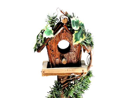 simsearch:400-04348779,k - little wooden birdhouse with leaves isolated on white background. Fotografie stock - Microstock e Abbonamento, Codice: 400-07289981
