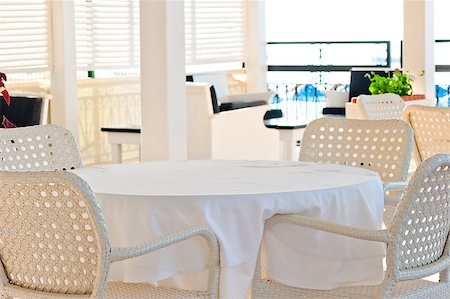 in the cafeteria wicker chairs and tables covered with cloth Stock Photo - Budget Royalty-Free & Subscription, Code: 400-07294088