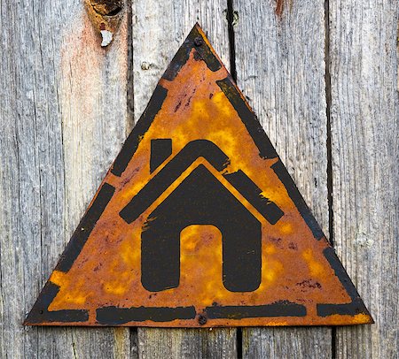 simsearch:400-07291694,k - Home Icon on Weathered Triangular Yellow Warning Sign. Grange Background. Stock Photo - Budget Royalty-Free & Subscription, Code: 400-07294552
