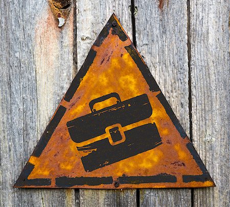 financial portfolio - Briefcase Icon on Weathered Triangular Yellow Warning Sign. Grange Background. Stock Photo - Budget Royalty-Free & Subscription, Code: 400-07294584