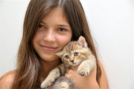 Portrait of pretty girl with a kitten Foto de stock - Royalty-Free Super Valor e Assinatura, Número: 400-07294635